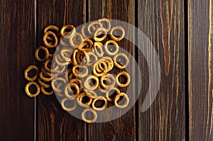 Traditional russian small bagels on dark rustic table background, top view, copy space