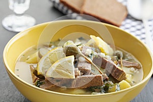 Traditional Russian soup Rassolnik with pickles, meat, and pearl barley