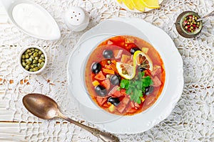 Traditional Russian soup Solyanka with meat, sausages, vegetables