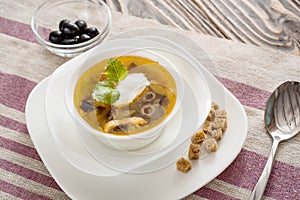 Traditional Russian soup solyanka saltwort closeup in a bowl on the table.