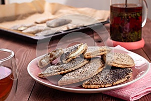 Traditional Russian sweet shortcrust pastry with quark or cottage cheese and raisins, sochni or sochniki pies or pirozhki with