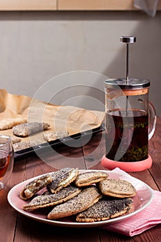 Traditional Russian sweet shortcrust pastry with quark or cottage cheese and raisins, sochni or sochniki pies or pirozhki with