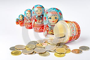 Traditional Russian toy matryoshka and money. White background.