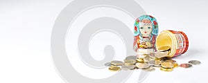 Traditional Russian toy matryoshka and money. White background. Copy space