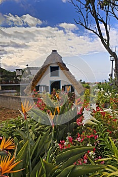 Traditional rustic cottage with thatched roof on Madeira island.