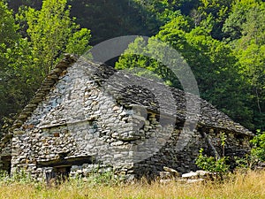 Traditional rustic house between Sonogno and Frasco, Ticino photo