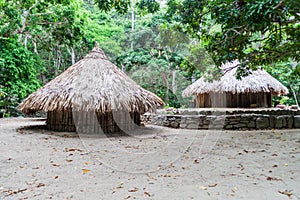 Traditional rustic houses of indigenous Kogi people photo
