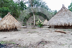 Traditional rustic houses of indigenous Kogi people photo