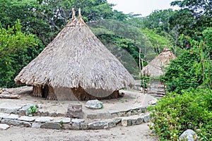 Traditional rustic houses of indigenous Kogi people photo