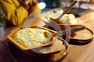 Traditional rustic treat in Montenegro is kachamak. Kachemak is a corn porridge mixed with crushed potatoes and kaymak, sheep