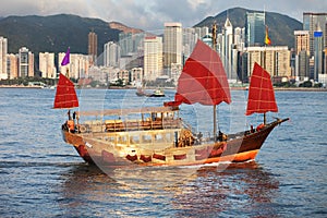 Traditional Sail junk ship in modern Hong Kong