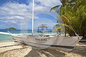 Traditional sailboat on Bora Bora beach