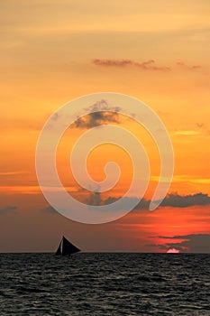 Traditional sailing boats on a sunset tour