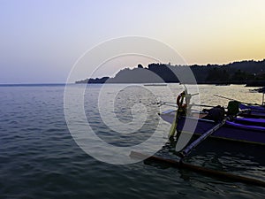 Traditional sailing wooden boat on the water parking at the harbour in summer holiday in Lampung, Indonesia