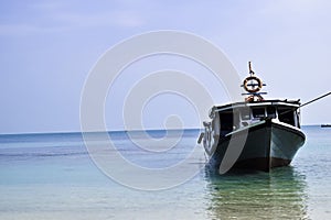 Traditional sailing wooden boat on the water parking at the harbour in summer holiday in Lampung, Indonesia