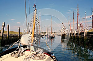 Traditional sailing yacht runs tidal harbor