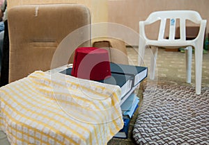 Traditional Samaritans headwear `fez` on Holy Books