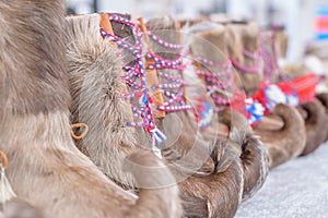 Traditional sami handmade footwear from reindeer fur photo