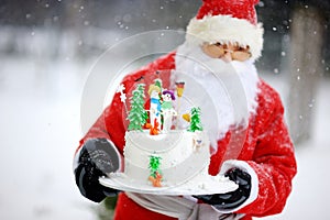 Traditional Santa Claus and a Christmas cake photo