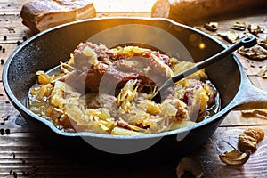Traditional sauerkraut soup from Slovakia with smoked sausages, mushrooms and bacon