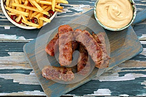 Traditional sausages mici on chopping board