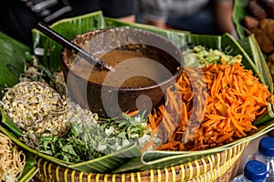 Sayur pecel with peanut sauce photo