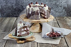 traditional schwarzwald cake with slice of cake