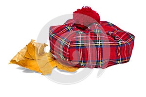Traditional Scottish Red Tartan Bonnet and Dry Maple Leaf