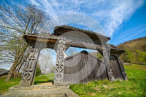 Traditional sculptured wooden gate at Barsana Monastery