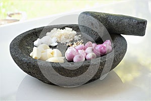 Traditional seasoning with mortar and pestle.