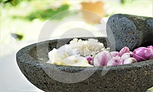 Traditional seasoning with mortar and pestle.