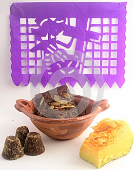 Mexican traditional pumpkin sweet made with piloncillo and cinammon on a clay pot, known as calabaza en tacha with decoration photo