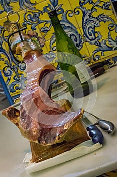 Traditional sevillan ham and wine in a restaurant photo