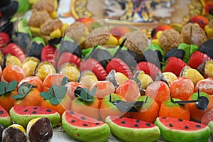 Traditional Sicilian frutta martorana assortment made of almond paste shaped in various fruits and veggies