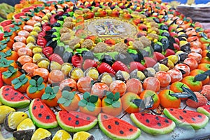 Traditional Sicilian frutta martorana assortment made of almond paste shaped in various fruits and veggies