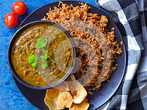 Traditional Sindhi meal-bhugge chawal and sai bhaji