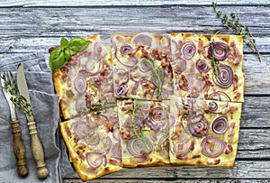 Traditional sliced german pizza or flammkuchen