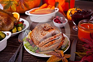 Traditional sliced honey glazed ham for festive Christmas or Thanksgiving table