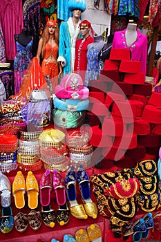 Traditional slippers, fez and caftan on display