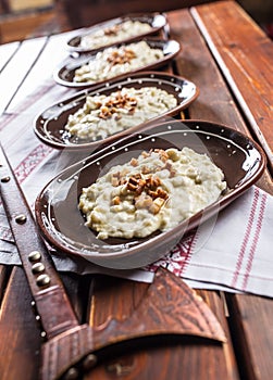 Traditional slovakian food Halusky with fried bacon and decorati photo