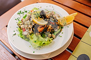 Traditional slovenian cuisine, seafood salad with fresh mussels, selective focus