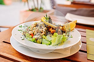 Traditional slovenian cuisine, seafood salad with fresh mussels, selective focus