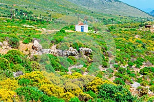 Traditional small Greek church and red roof Greece