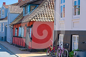 a traditional small,red,danish framehouse in summer in Bornholm with blue sky photo