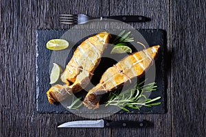 Traditional smoked halibut fish steaks with lime