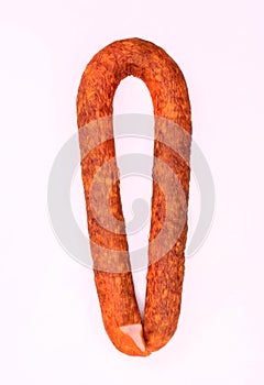 Traditional smoked pork sausage, long, isolated. Polish meat sausage, a packshot photo for package design.