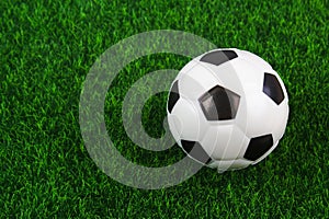 Traditional soccer ball on soccer field. Football ball on green grass stadium football field, game, sport. Background