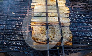 Traditional South African braai broodjies prepared on open coals