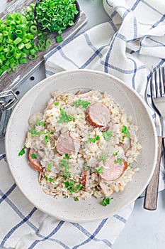 Traditional South Carolina chicken bog dish with smocked sausages, vertical, top view