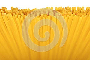 Traditional spaghetti vertical pattern, large detailed horizontal isolated raw dry long uncooked egg pasta macro closeup, natural